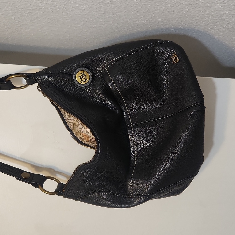A black "The Sak" purse